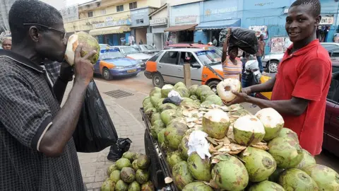 Fresh coconut meat sold roadside in Nigeria for diabetes management