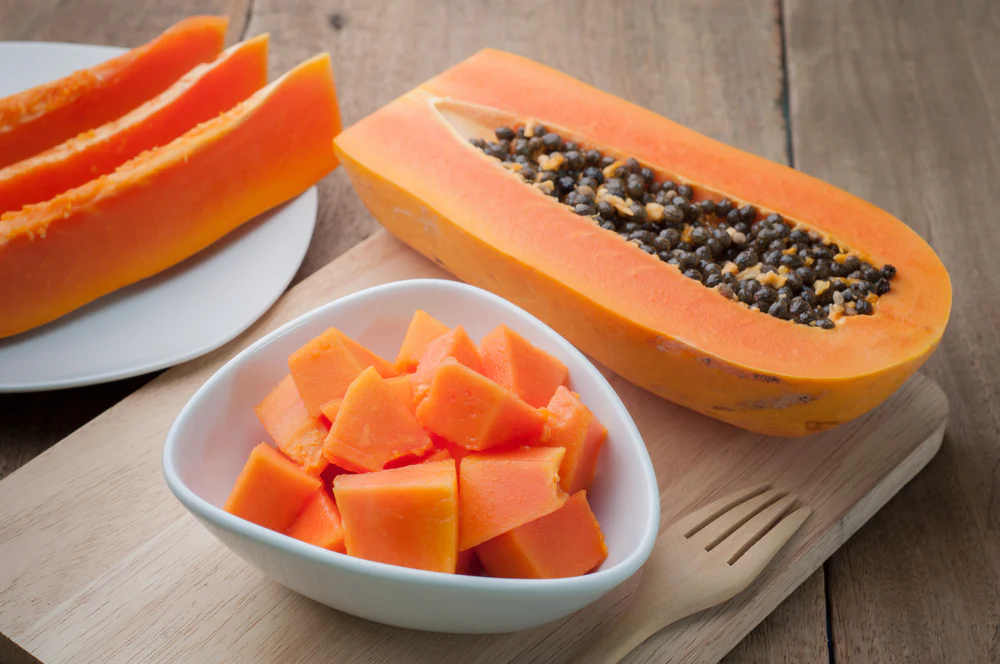 Ripe pawpaw papaya sliced on plate for healthy Nigerian diet