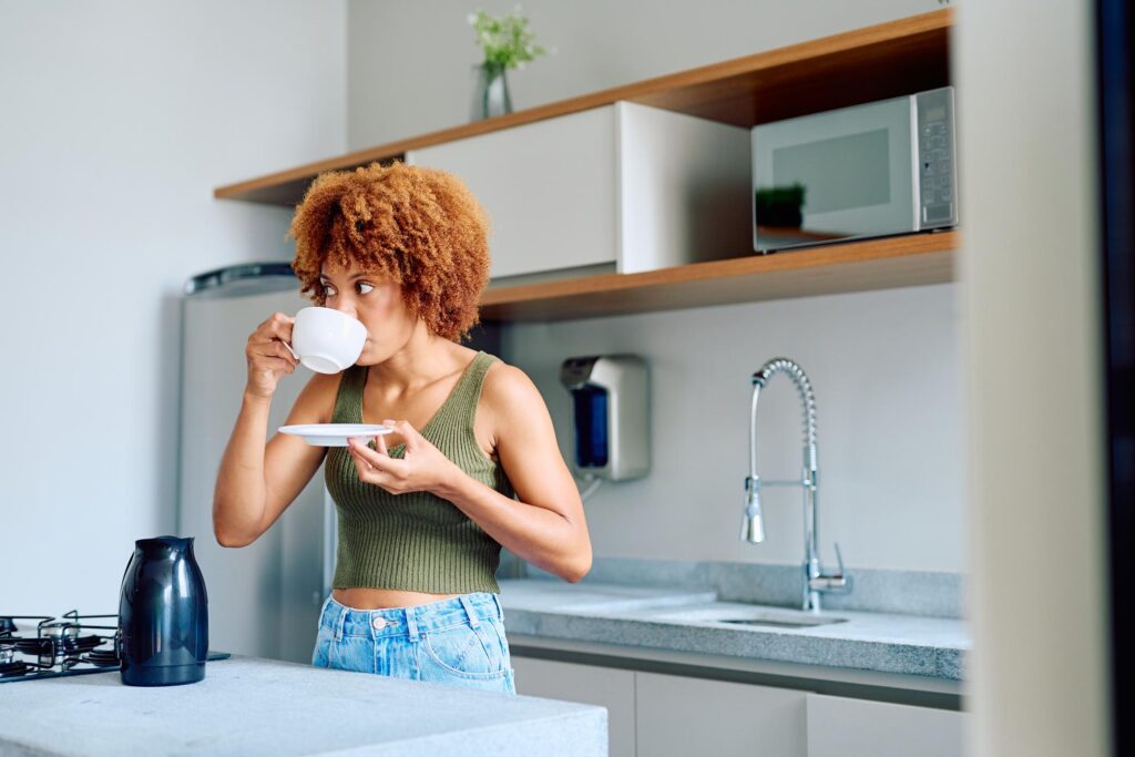 African woman drinking coffee morning lifestyle